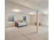 A spacious and well-lit basement with neutral carpeting offers flexible space for various activities or storage needs at 7158 W Belmont Dr, Littleton, CO 80123