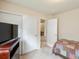 Cozy bedroom with neutral tones, closet, and easy access to other rooms provides a comfortable, functional space at 7158 W Belmont Dr, Littleton, CO 80123