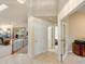 Inviting foyer with tile flooring that leads to the living room and staircase at 7158 W Belmont Dr, Littleton, CO 80123