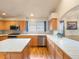 Well-equipped kitchen with tiled countertops, stainless steel appliances, and wood cabinets at 7158 W Belmont Dr, Littleton, CO 80123