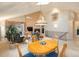 Open concept living room with a fireplace, a skylight, a dining area, and lots of natural light at 7158 W Belmont Dr, Littleton, CO 80123