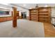 Spacious finished basement with custom built-ins, shelving, and wet bar, perfect for entertaining at 1394 E Panama Dr, Centennial, CO 80121
