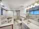 Elegant bathroom with a soaking tub, shower, and marble accents at 1394 E Panama Dr, Centennial, CO 80121