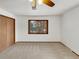 Cozy bedroom with neutral carpet and a ceiling fan at 1394 E Panama Dr, Centennial, CO 80121