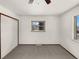 Simple bedroom with neutral carpet and view to the outside at 1394 E Panama Dr, Centennial, CO 80121