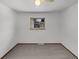 Neutral bedroom with carpeted floors and a window offering natural light at 1394 E Panama Dr, Centennial, CO 80121