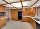 Well-equipped kitchen with built-in oven, ample storage, and tiled floor at 1394 E Panama Dr, Centennial, CO 80121