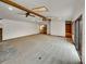 Large living room with exposed beams, skylights, and access to deck at 1394 E Panama Dr, Centennial, CO 80121
