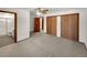 Spacious main bedroom with ceiling fan and a bathroom at 1394 E Panama Dr, Centennial, CO 80121