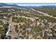 Expansive view of wooded landscape and mountain ranges in the distance at 2851 Interlocken Dr, Evergreen, CO 80439