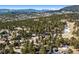 Aerial view of neighborhood among snow-dusted mountains at 2851 Interlocken Dr, Evergreen, CO 80439