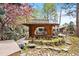 Backyard gazebo with a pond and lush landscaping in a serene setting at 2851 Interlocken Dr, Evergreen, CO 80439