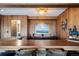 Close up view of custom wet bar with bar top seating and unique architectural detail at 2851 Interlocken Dr, Evergreen, CO 80439