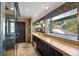 Modern bathroom featuring a glass-enclosed shower, a double vanity, and natural light, offering a spa-like experience at 2851 Interlocken Dr, Evergreen, CO 80439