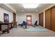 Inviting exercise room with modern equipment, a large mirror, and a wooden desk at 2851 Interlocken Dr, Evergreen, CO 80439