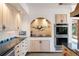 Gourmet kitchen featuring custom tiled cooktop alcove, and double oven with plenty of cabinetry at 2851 Interlocken Dr, Evergreen, CO 80439