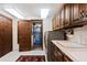 Functional laundry room with wood cabinetry, sink, washer, dryer, and plenty of storage space at 2851 Interlocken Dr, Evergreen, CO 80439