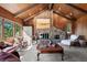 Inviting living room with a stone fireplace, comfortable seating, and a rustic-style decor at 2851 Interlocken Dr, Evergreen, CO 80439