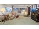 Charming living room with floral sofa, accent chair, and decorative cabinet at 2851 Interlocken Dr, Evergreen, CO 80439