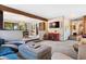 Spacious living room with an open layout and a view into the dining room, perfect for entertaining guests at 2851 Interlocken Dr, Evergreen, CO 80439