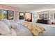 Bright main bedroom featuring a comfortable bed, ample natural light, and stylish furnishings at 2851 Interlocken Dr, Evergreen, CO 80439