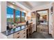 Office with built-in desk, drawers, mountain views, and carpeted flooring at 2851 Interlocken Dr, Evergreen, CO 80439