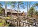Lush backyard pond featuring rock accents and charming bridge at 2851 Interlocken Dr, Evergreen, CO 80439