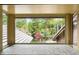 Stunning views of a backyard with green trees are showcased from the expansive window at 2851 Interlocken Dr, Evergreen, CO 80439