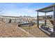 Landscaped backyard with a retaining wall and open space at 8086 S Grand Baker Way, Aurora, CO 80016