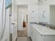 Clean bathroom with double vanity and a view into a bedroom at 8086 S Grand Baker Way, Aurora, CO 80016
