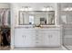 Spa-like bathroom with double vanity and a large mirror at 8086 S Grand Baker Way, Aurora, CO 80016