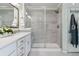 Modern bathroom with a walk-in shower and double vanity at 8086 S Grand Baker Way, Aurora, CO 80016