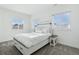 Bright bedroom with a queen-size bed and two windows at 8086 S Grand Baker Way, Aurora, CO 80016