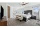 Spacious primary bedroom with large windows and plush carpeting at 8086 S Grand Baker Way, Aurora, CO 80016