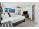 Comfortable bedroom with a king-size bed and ensuite bathroom access at 8086 S Grand Baker Way, Aurora, CO 80016