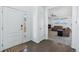 Bright entryway with hardwood floors, leading to the living room and stairs at 8086 S Grand Baker Way, Aurora, CO 80016