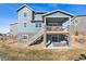Two-story home with a large covered patio and backyard at 8086 S Grand Baker Way, Aurora, CO 80016