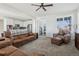 Living room features a comfortable seating area and open kitchen view at 8086 S Grand Baker Way, Aurora, CO 80016