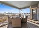 Covered patio with wicker furniture and scenic views at 8086 S Grand Baker Way, Aurora, CO 80016