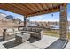 Covered patio with seating area and distant mountain views at 8086 S Grand Baker Way, Aurora, CO 80016