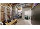 Unfinished basement area with exposed ductwork, a water heater, and a storage area at 4502 Echo Cliff Ln, Larkspur, CO 80118