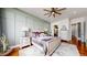 Inviting bedroom with accent wall, mountain views and hardwood floors, offering a serene retreat at 4502 Echo Cliff Ln, Larkspur, CO 80118