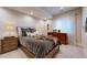 Relaxing bedroom featuring a plush bed, soft lighting, and neutral decor at 4502 Echo Cliff Ln, Larkspur, CO 80118