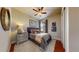 Cozy bedroom with hardwood floors, neutral walls, stylish furnishings and lots of natural light at 4502 Echo Cliff Ln, Larkspur, CO 80118