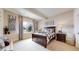 Cozy bedroom featuring a comfortable bed, soft lighting, and a scenic winter view at 4502 Echo Cliff Ln, Larkspur, CO 80118