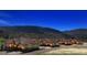 Scenic view of a community against a stunning mountain backdrop under a starry night sky at 4502 Echo Cliff Ln, Larkspur, CO 80118