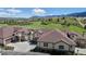 High angle exterior view of homes with neutral stucco, and multi car garages at 4502 Echo Cliff Ln, Larkspur, CO 80118