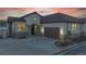 Beautiful home featuring manicured landscaping, a spacious driveway, and an attached garage at 4502 Echo Cliff Ln, Larkspur, CO 80118