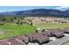 High angle exterior view of homes situated near a scenic, grassy hillside at 4502 Echo Cliff Ln, Larkspur, CO 80118