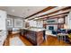 Gourmet kitchen with large island, granite countertops, stainless steel appliances, and hardwood floors at 4502 Echo Cliff Ln, Larkspur, CO 80118
